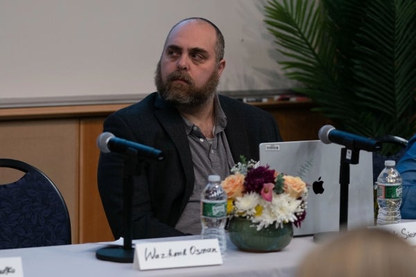 Matt Sienkiewicz sits at a table